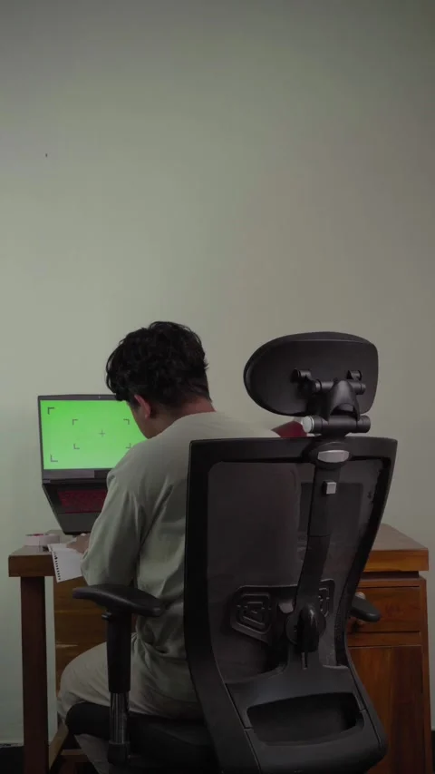 Back view of freelancer in front of laptop Stock Footage 320245930