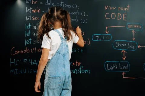 Back view of girl write the code about getting time on blackboard. Erudition. Foto stock