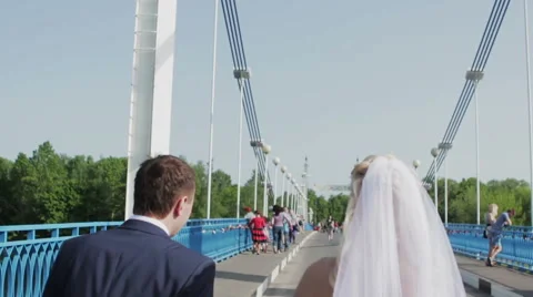 Back view going couple. walking friendly girl and guy holding hands. Stock Footage 57811088
