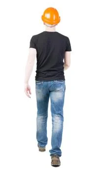 Back view of going engineer in construction helmet Stock Photos