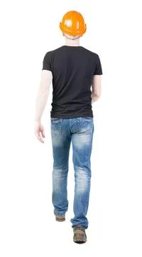Back view of going engineer in construction helmet Back view of going engi... Foto stock