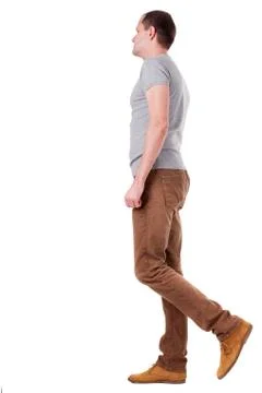 Back view of going  handsome man in jeans and a shirt Stock Photos
