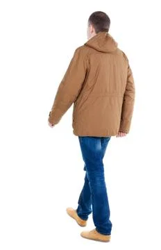 Back view of going  handsome man in brown parka Foto stock