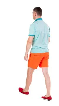 Back view of going  handsome man in shorts.  walking young guy Stock Photos