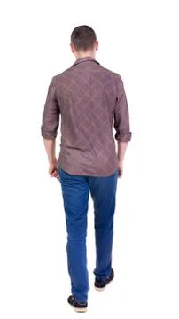 Back view of going  handsome man in jeans and a shirt Foto stock