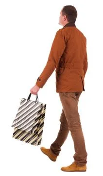 Back view of going  handsome man with shopping bags Stock Photos