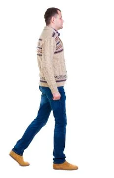 Back view of going  handsome man in jeans and warm sweater Stock Photos