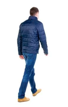 Back view of going  handsome man in jeans and jacket Stock Photos