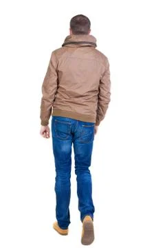 Back view of going  handsome man in brown wind breaker Stock Photos