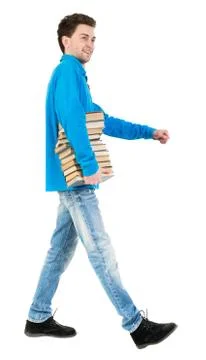 Back view of going  handsome man carries a stack of books Stock Photos