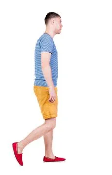 Back view of going  handsome man in shorts.  walking young guy Stock Photos
