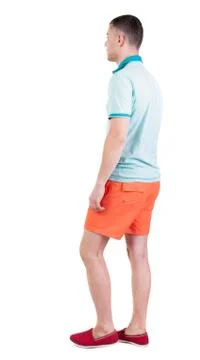 Back view of going  handsome man in shorts.  walking young guy Stock Photos