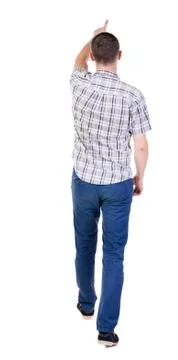 Back view of going  handsome man in jeans and a shirt Stock Photos