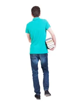 Back view of going  handsome man carries a stack of books Stock Photos