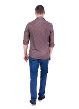 Back view of going  handsome man in jeans and a shirt Stock Photos