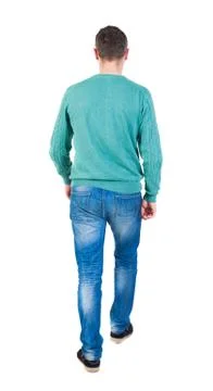 Back view of going  handsome man in jeans and a shirt Stock Photos