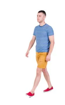 Back view of going  handsome man in shorts.  walking young guy Stock Photos