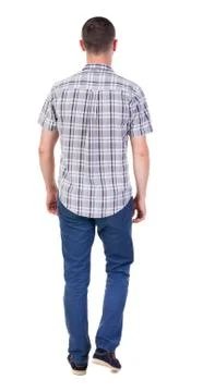 Back view of going  handsome man in jeans and a shirt Stock Photos