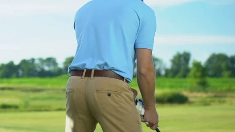 Back view golfer making driver shot from... | Stock Video | Pond5