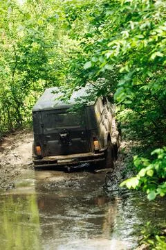 Back view of green russian off-road utility vehicle UAZ Hunter broke down Stock Photos