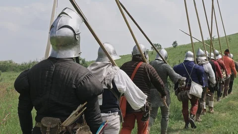 Back view of group medieval knights going on the battle. Military campaign of Stock Footage 115430700