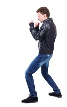 Back view of guy funny fights waving his arms and legs Foto stock