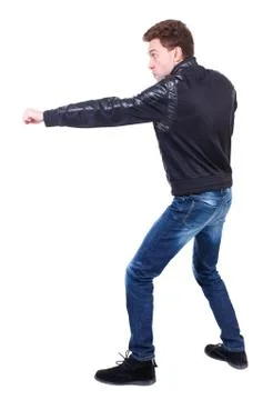 Back view of guy funny fights waving his arms and legs Stock Photos
