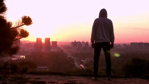 Back view guy in town break of dawn Stock Footage 132200064