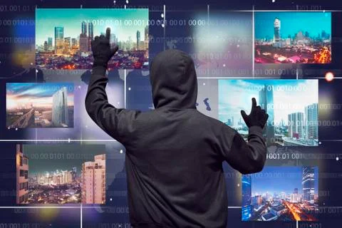 Back view of a hacker man touching virtual monitor Stock-Fotos