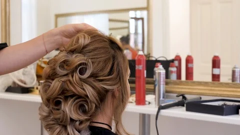 Back view of hairstyling process Stock Footage 104904778