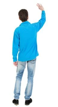 Back view of handsome man greeting waving from his hands Stock Photos