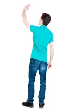 Back view of handsome man greeting waving from his hands Stock Photos