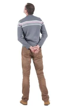 Back view of handsome man in sweater and jeans  looking up Stock Photos