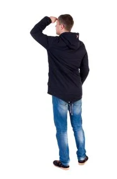 Back view of handsome man in winter jacket  looking up Stock-Fotos