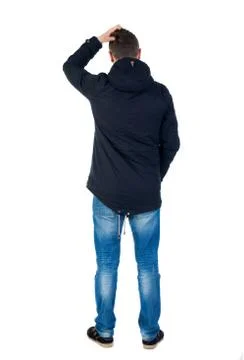 Back view of handsome man in winter jacket  looking up Stock Photos