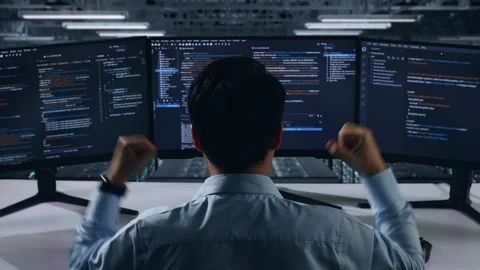 Back View Of Happy Man Developer Celebrating While Write Code In Data Center Stock Footage 270227052