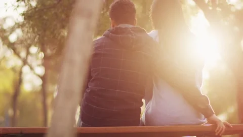 Back view happy romantic couple sitting ... | Stock Video | Pond5