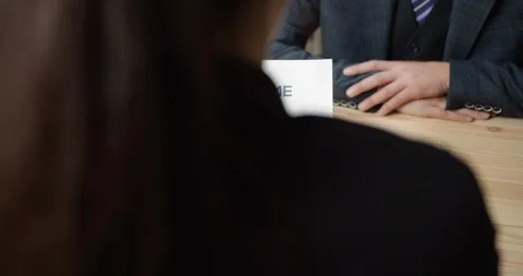 Back view of hr manager holding resume application Stock Footage 125498078