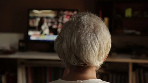 Back view of an Indian old man is watching television. Vídeos de archivo 117126355