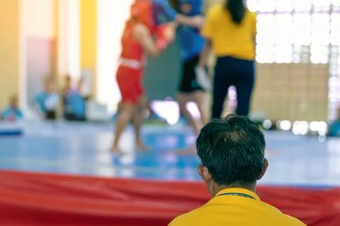 Back view of Judges work during Wushu Boxing Cup among young women, juniors.. Stock Photos