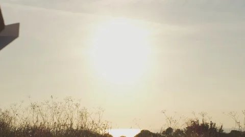 Back view of kid playing with paper plane in park Stock Footage 129422598