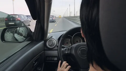Back view lady driver in car Stock Footage 81863988