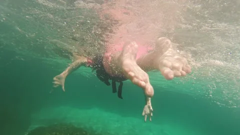 Back view of little girl swimming underw... | Stock Video | Pond5