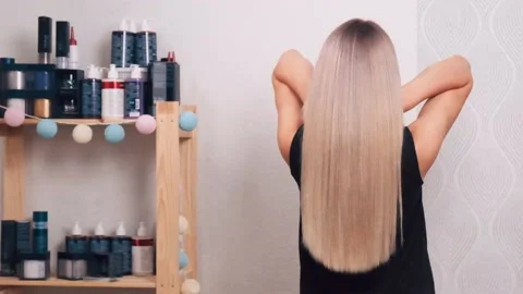 Back view of long shiny blond healthy hair. Stock Footage 139338696