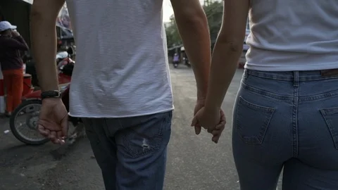 Back view love couple walks in the city at sunrise rapid slow motion Stock Footage 88710675