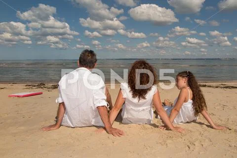 Back view of lovely family in white Stock Photos