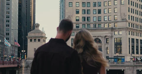 Back view of a loving couple standing and admiring the architecture of historic Stock-Footage 347012499