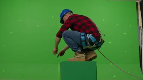 Back view of a male builder in professional ammunition Stock Footage 247699436