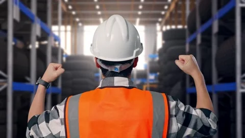 Back View Of A Male Engineer Raising His Hands Celebrating Working Tire Video stock 341787382
