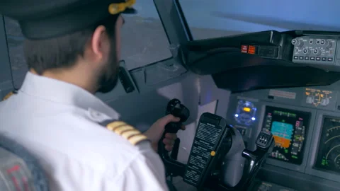 Back view of a male pilot managing an aircraft Stock Footage 93659704